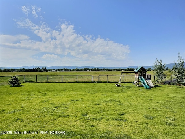1714 River Meadows Dr, Victor, ID 83455 - view of yard with a playground, a view of countryside, and a mountain view