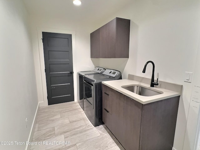 1714 River Meadows Dr, Victor, ID 83455 - laundry room featuring cabinet space, separate washer and dryer, and light marble finish floors