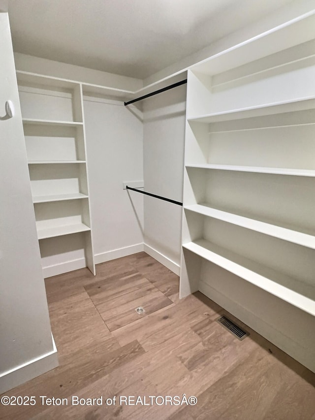1714 River Meadows Dr, Victor, ID 83455 - walk in closet featuring wood finished floors
