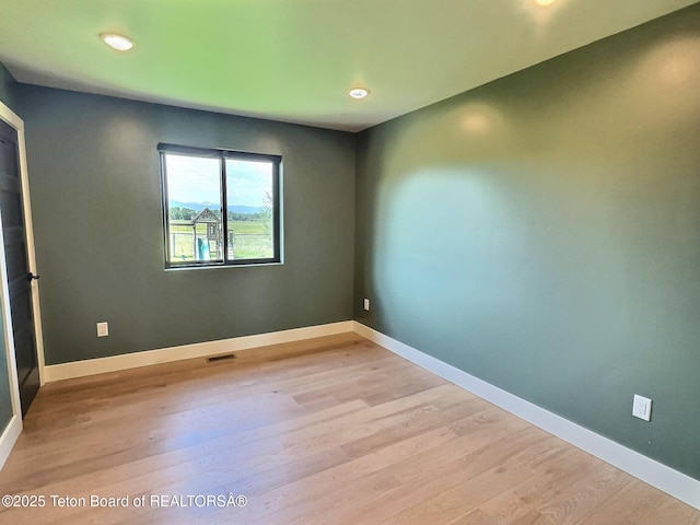 1714 River Meadows Dr, Victor, ID 83455 - empty room with wood finished floors and recessed lighting