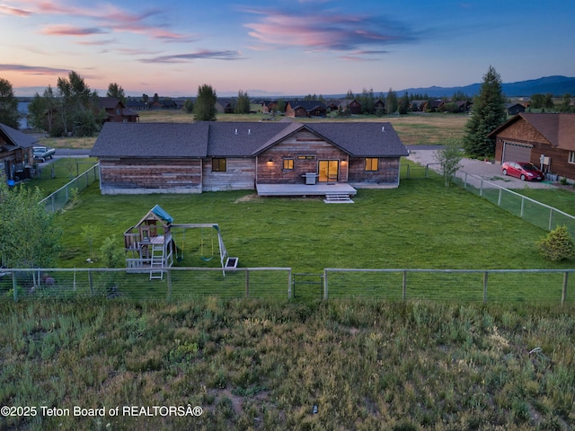 1714 River Meadows Dr, Victor, ID 83455 - rear view of property with a fenced backyard, a garage, and a deck