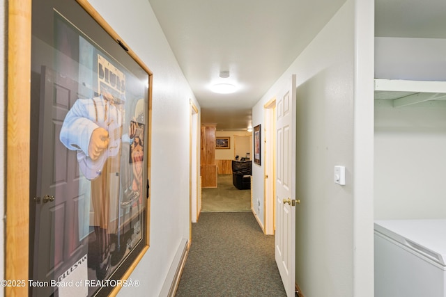 corridor featuring dark carpet