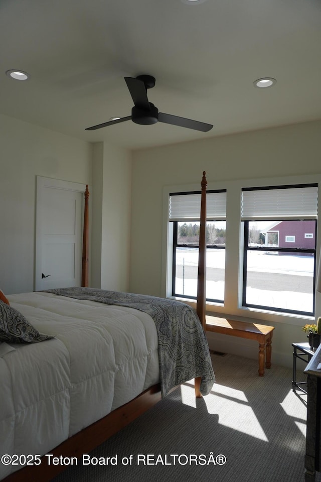 825 Mccoy Dr, Pinedale, WY 82941 - carpeted bedroom featuring multiple windows, ceiling fan, and recessed lighting