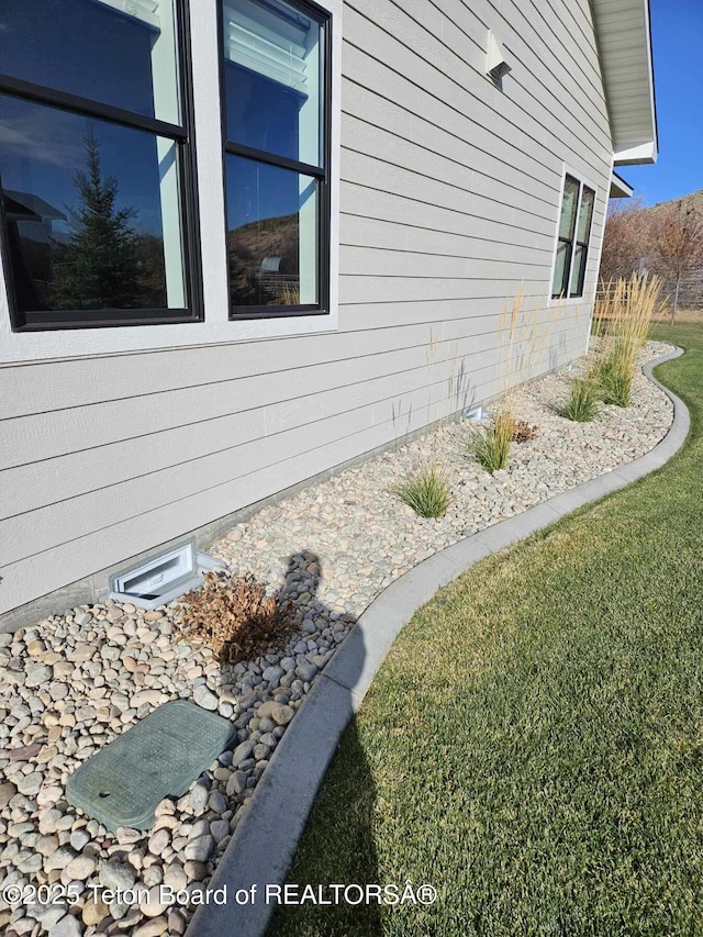 825 Mccoy Dr, Pinedale, WY 82941 - view of property exterior featuring a lawn