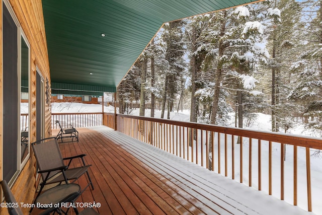 view of snow covered deck