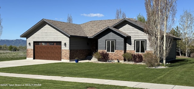 398 Palisade Trl, Driggs, ID 83422 - view of front of home with a garage, stone siding, driveway, and a front yard