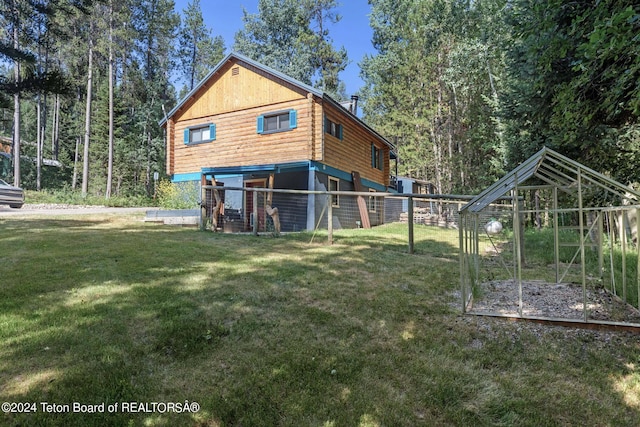 exterior space with a yard and log exterior