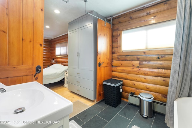 bathroom featuring log walls, tile patterned flooring, recessed lighting, and baseboard heating