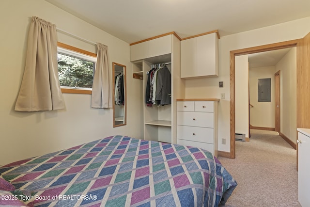 bedroom with electric panel, light colored carpet, a closet, a baseboard heating unit, and baseboards