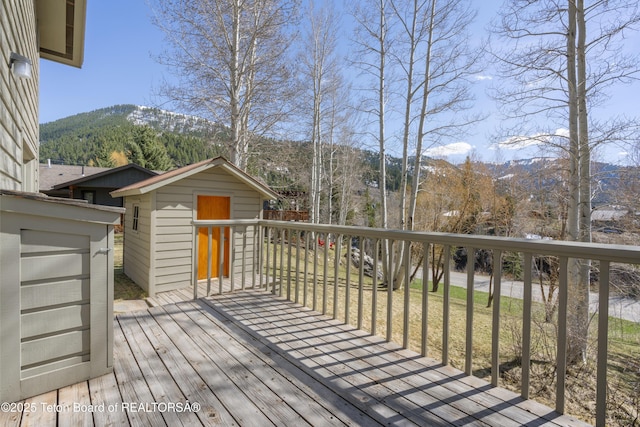 wooden terrace featuring a mountain view