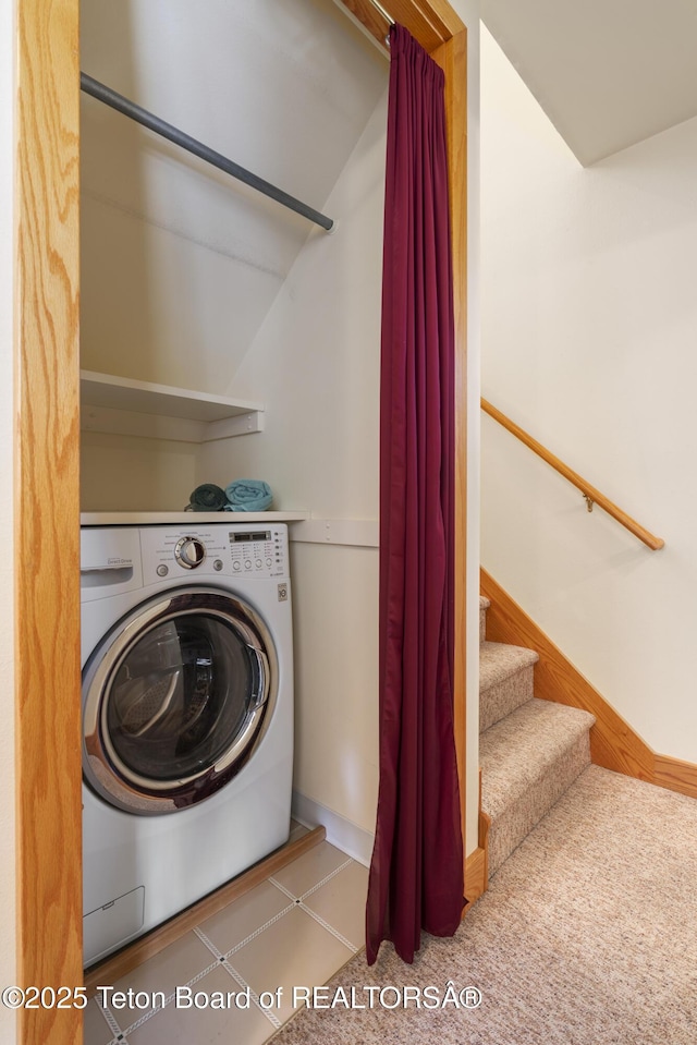 laundry area featuring washer / dryer and baseboards