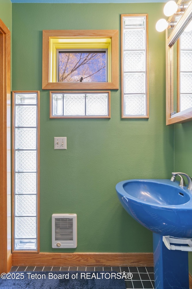 bathroom featuring tile patterned floors and baseboards