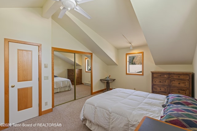 carpeted bedroom with a baseboard heating unit, baseboards, a closet, and ceiling fan