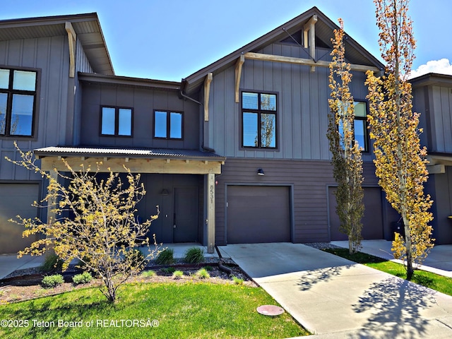 8531 Caribou Ct, Victor, ID 83455 - view of front of property featuring board and batten siding, driveway, and an attached garage