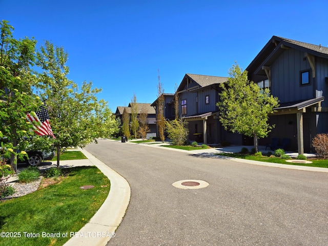 8531 Caribou Ct, Victor, ID 83455 - view of asphalt road with curbs and a residential view