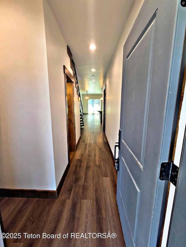 8531 Caribou Ct, Victor, ID 83455 - corridor featuring dark wood-type flooring, recessed lighting, baseboards, and a barn door