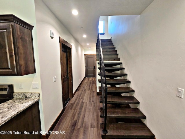 8531 Caribou Ct, Victor, ID 83455 - staircase featuring wood finished floors, recessed lighting, and baseboards