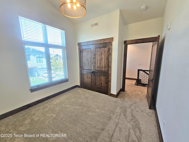 8531 Caribou Ct, Victor, ID 83455 - bedroom featuring carpet floors, baseboards, and lofted ceiling