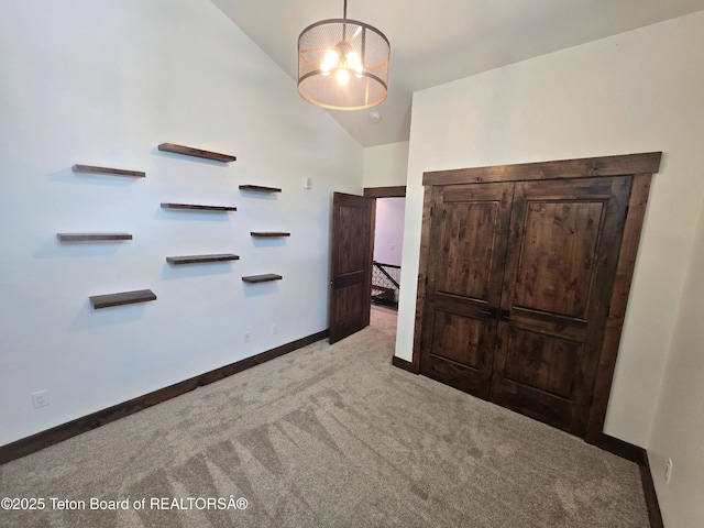 8531 Caribou Ct, Victor, ID 83455 - carpeted bedroom featuring vaulted ceiling and baseboards