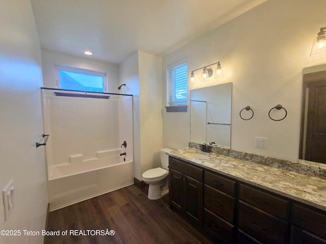 8531 Caribou Ct, Victor, ID 83455 - bathroom featuring wood finished floors,  shower combination, double vanity, and toilet