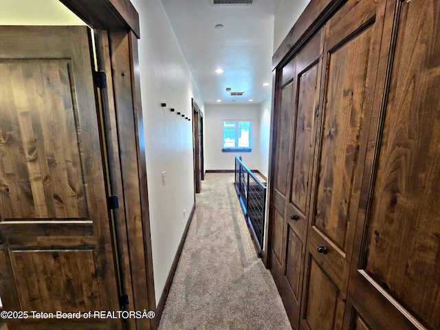 8531 Caribou Ct, Victor, ID 83455 - hallway with light colored carpet, baseboards, and recessed lighting
