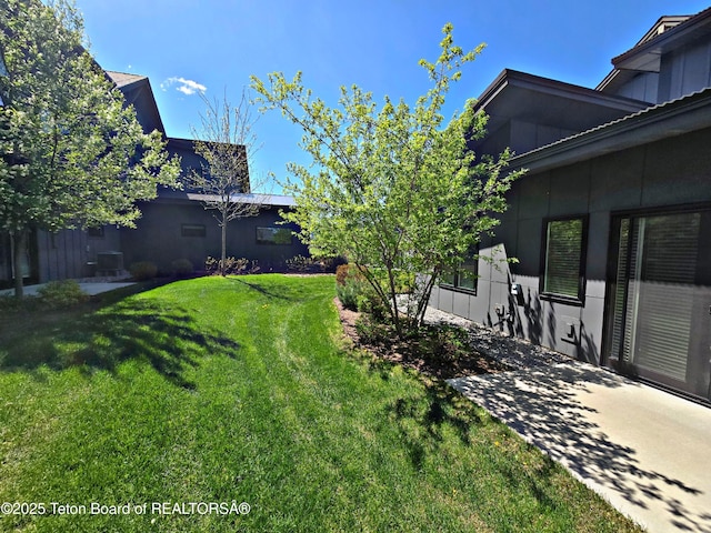 8531 Caribou Ct, Victor, ID 83455 - view of green lawn featuring central AC