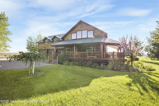 980 S 1000 E, Driggs, ID 83455 - view of front of house featuring a front yard, metal roof, and a garage