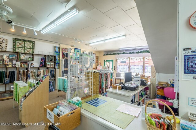 interior space featuring ceiling fan and track lighting