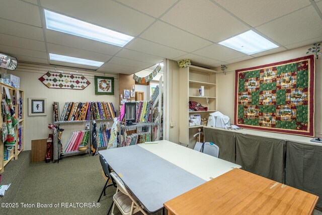interior space featuring a drop ceiling