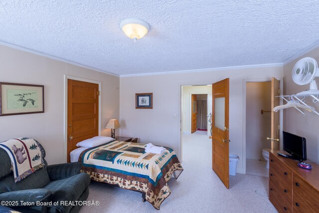 bedroom with light carpet, ornamental molding, and a textured ceiling