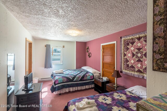 bedroom featuring a baseboard radiator, carpet floors, a textured wall, and a textured ceiling