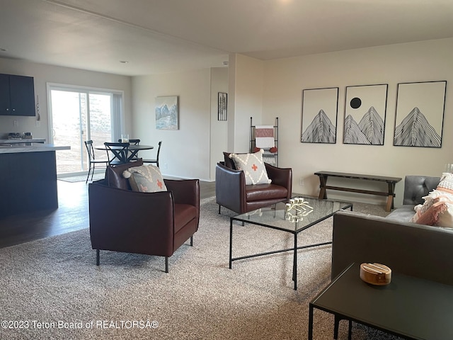 living room featuring light carpet