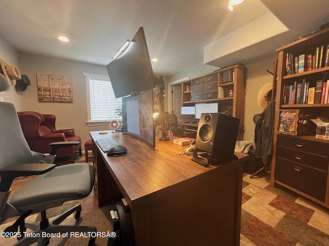 office area with recessed lighting and a textured ceiling
