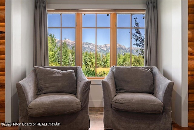 3300 N Trapper Ln, Wilson, WY 83014 - living area featuring rustic walls, wood finished floors, and a mountain view