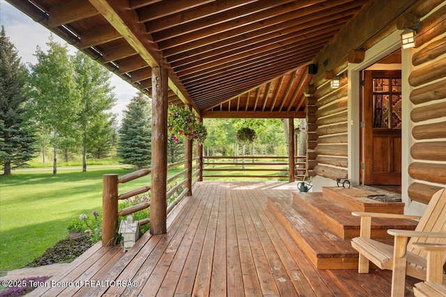 3300 N Trapper Ln, Wilson, WY 83014 - wooden terrace featuring a yard and view of scattered trees