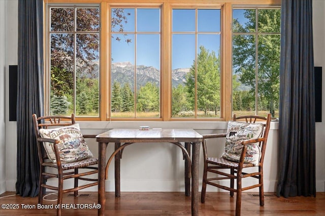 3300 N Trapper Ln, Wilson, WY 83014 - dining room featuring wood finished floors and a mountain view