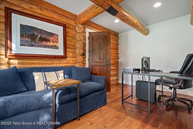 3300 N Trapper Ln, Wilson, WY 83014 - office with log walls, beamed ceiling, wood finished floors, and recessed lighting