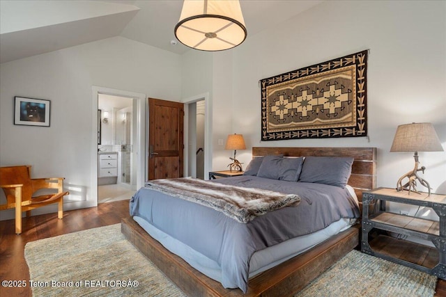 3300 N Trapper Ln, Wilson, WY 83014 - bedroom with wood finished floors, lofted ceiling, and ensuite bath