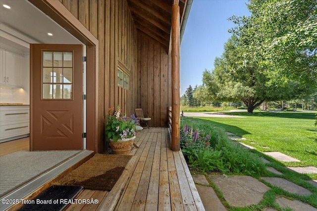 3300 N Trapper Ln, Wilson, WY 83014 - doorway to property featuring board and batten siding and a yard