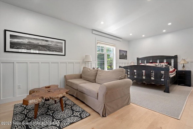 3300 N Trapper Ln, Wilson, WY 83014 - bedroom featuring a decorative wall, wood finished floors, recessed lighting, and a wainscoted wall