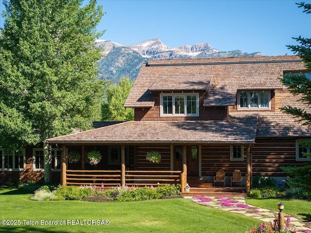 3300 N Trapper Ln, Wilson, WY 83014 - view of front of home featuring a front yard and a mountain view