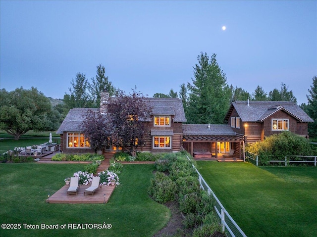 3300 N Trapper Ln, Wilson, WY 83014 - back of house featuring a chimney and a patio
