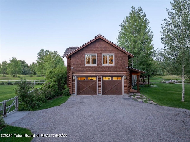 3300 N Trapper Ln, Wilson, WY 83014 - view of side of property featuring an attached garage and driveway