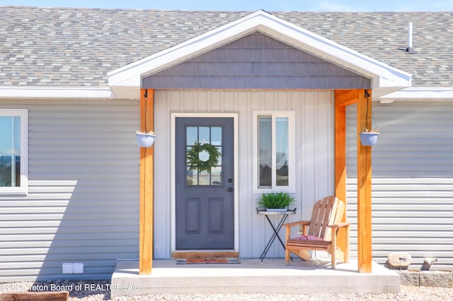 50 Shriver Ln, Pinedale, WY 82941 - entrance to property with roof with shingles and board and batten siding