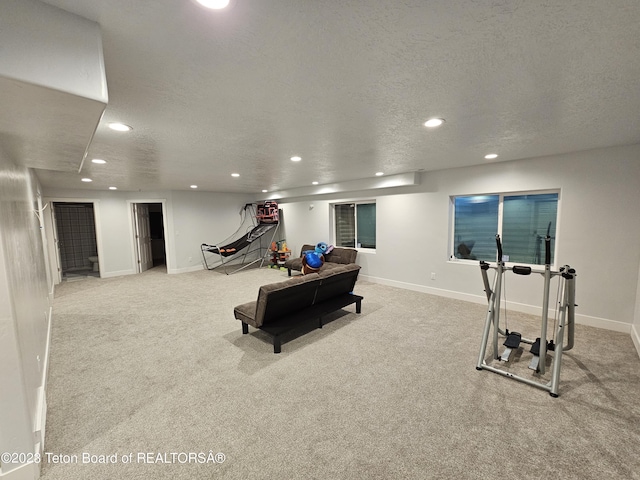 workout room with baseboards, recessed lighting, carpet, and a textured ceiling