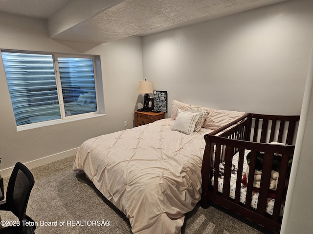 bedroom featuring carpet flooring and baseboards