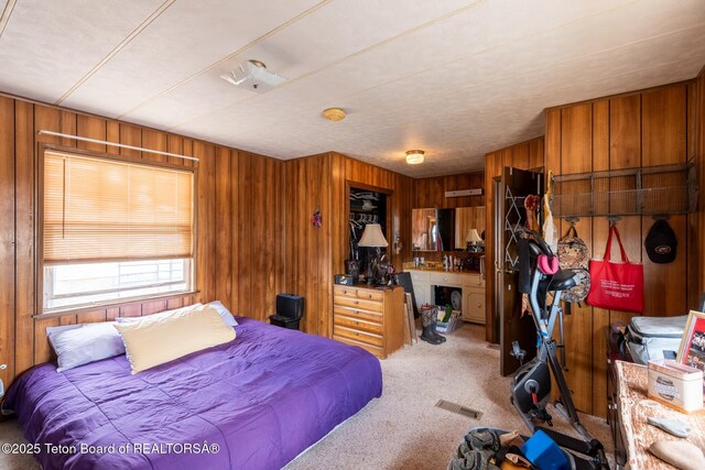 44 12th St, Marbleton, WY 83113 - carpeted bedroom with wood walls and a closet