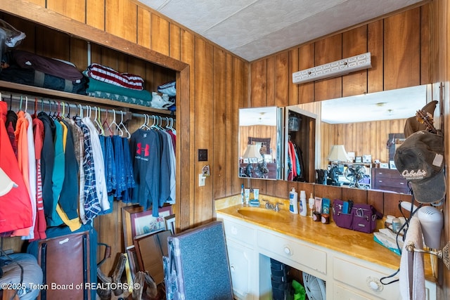 44 12th St, Marbleton, WY 83113 - interior space featuring wooden walls, vanity, and a textured ceiling