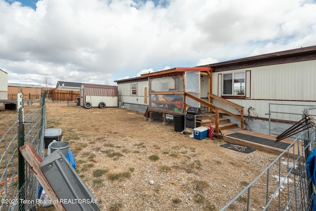 44 12th St, Marbleton, WY 83113 - view of yard featuring an outdoor structure and fence