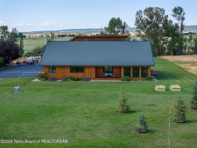 1820 Fall Line Dr, Driggs, ID 83422 - view of front of home with metal roof and a front lawn